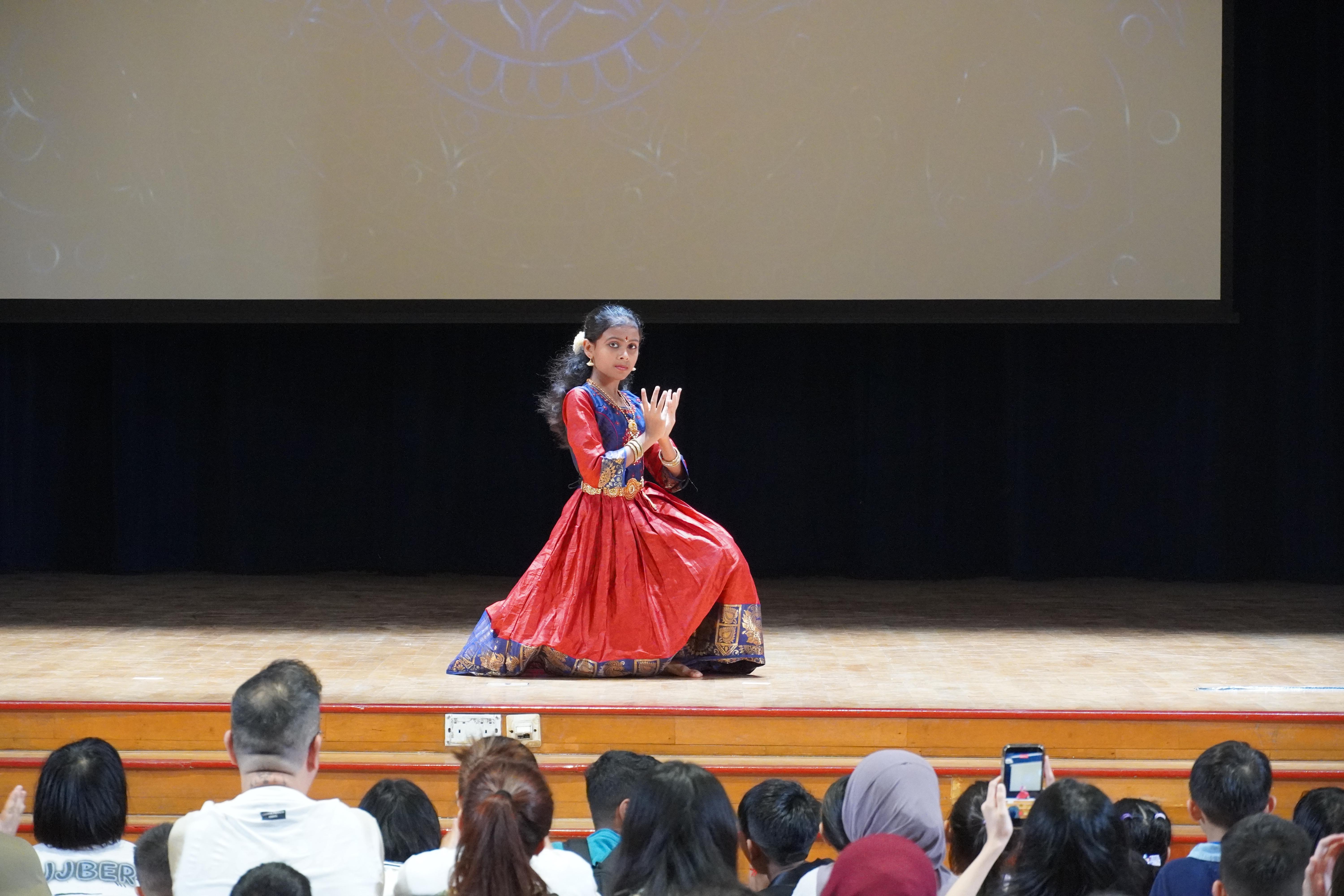 A beautiful solo performance takes centre stage, captivating the audience with graceful movements and expressive poses.